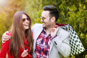 Fototapeta premium Young happy couple with shopping bags