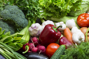 Background of fresh vegetables and greens closeup