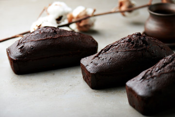 Tasty chocolate cake and cotton flowers