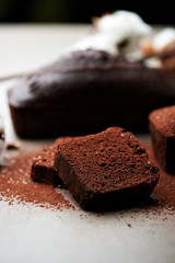 Tasty chocolate cake and cotton flowers