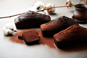Tasty chocolate cake and cotton flowers