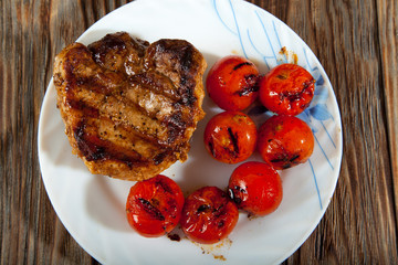 Delicious beef steaks on wooden table