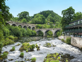 Fototapeta na wymiar River Dee with road and railway bridges in Llangollen Denbighshire Wales UK