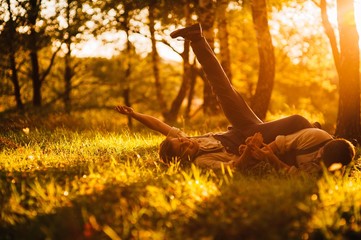 two brothers playing in grass