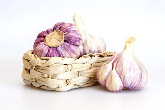 Heads of fresh garlic on a kitchen table