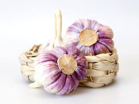 Heads of fresh garlic on a kitchen table