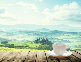 cup coffee and tuscany hills, Italy