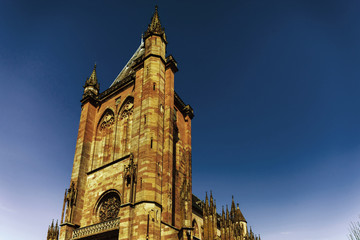 Fototapeta premium Majestic gothic cathedral in little city Niederhaslach