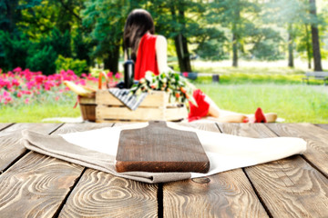 wooden table and woman on grass 