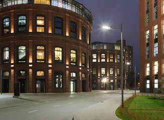 Extensive office complex exterior in loft style. Red brick buildings of former factory, gasholders....