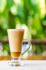 latte coffee cup on wooden table ,soft focus