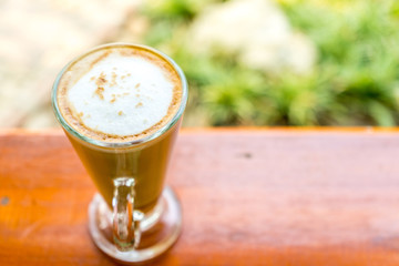 latte coffee cup on wooden table ,soft focus