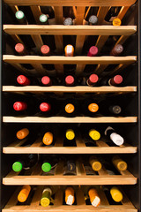 Wine cooler full of wine bottles