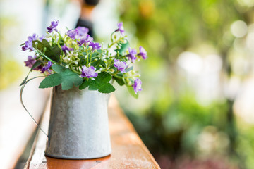 Beautiful flowers in vase on wooden table ,soft focus