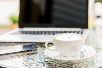 cappuccino coffee cup on table ,soft focus