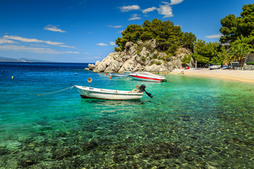 Beautiful bay and beach with motorboats,Brela,Dalmatia region,Croatia,Europe - obrazy, fototapety, plakaty