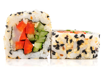 Vegetarian fresh sushi rolls with roasted sesame seeds isolated