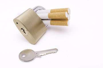 Locked cigarettes isolate on white stop smoking concept