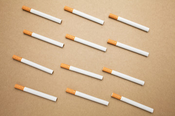 A Cigarettes are flat lay on brown background