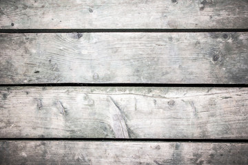 Grunge gray and brown wooden desks background.
