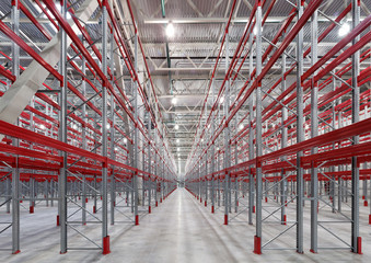  Industrial racks pallets shelves in huge empty warehouse interior.  Storage equipment.