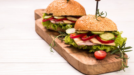 home made burger on vintage wooden background