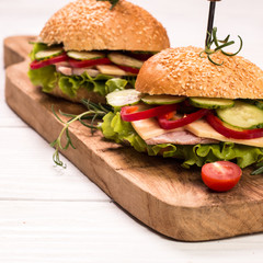 home made burger on vintage wooden background