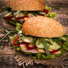 home made burger on vintage wooden background