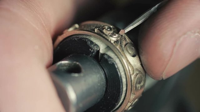 Jewelry Work. Processing of Gold Ring. Close-Up
