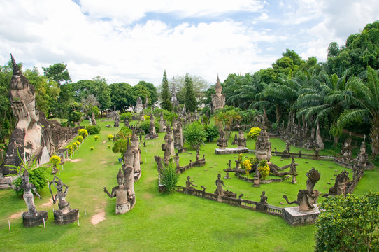 Amazing view of mythology and religious statues at Wat Xieng Khuan Buddha park. Vientiane, Laos. Famous travel tourist landmark of Buddhist stone statues and religious figures.