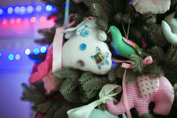 soft Christmas toys on the Christmas tree