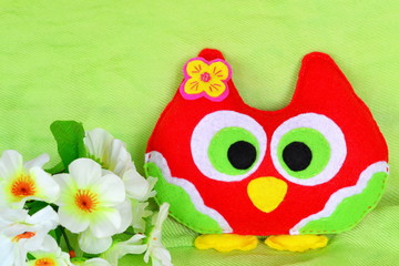 Fototapeta premium Handmade felt colorful owl. Child's toy