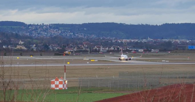 Stuttgart, Germany - NOVEMBER 17, 2015: Passenger jet plane on the runway in the airport.