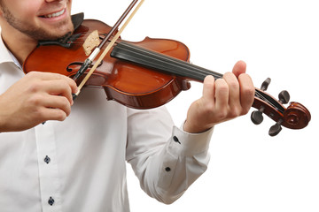 Musician plays violin isolated on white background, close up