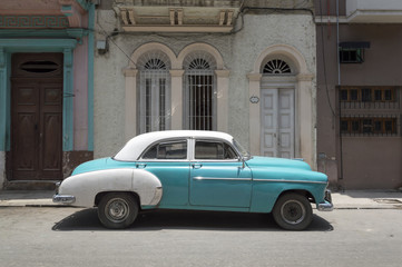 A classic american car in the streets of Old Havana on a sunny day