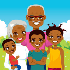 Cute African American Grandparents With Grandchildren family together on park smiling happy