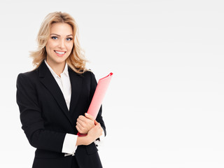 Young smiling businesswoman with red folder