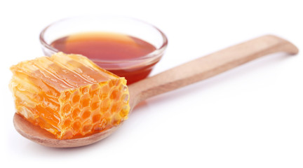 Honey comb with honey in a glass bowl