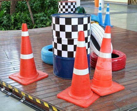 Orange Cones with Painted Tires and Traffic Barrels
