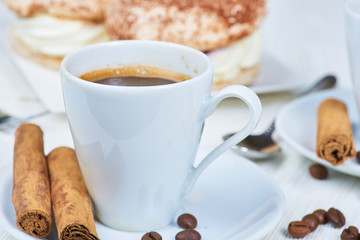 Coffee cup and cakes