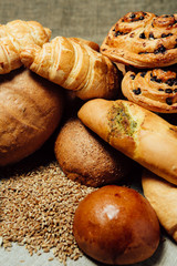 Assortment of baked bread on wood table
