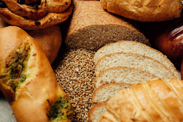 Assortment of baked bread on wood table