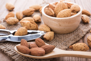 almonds set on the wooden plate, morning light