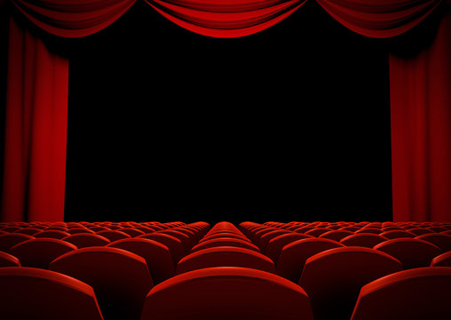 Theater stage with red curtains and seats