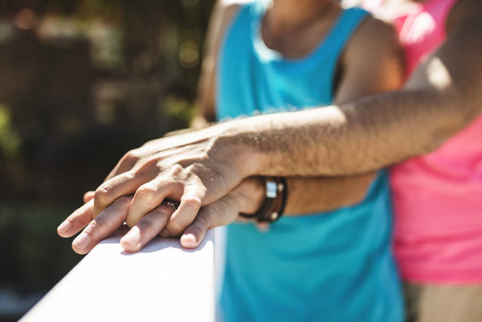 Clasped hands of gay couple