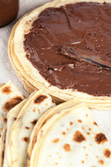 Pancakes crepes with chocolate for breakfast