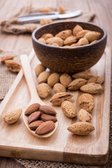 almonds set on the wooden plate, morning light,close up