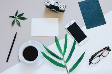 Creative flat lay photo of workspace desk with smartphone, coffe