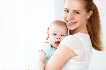 happy family mother playing  with baby