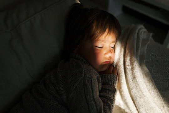 Little boy sleeping on the couch